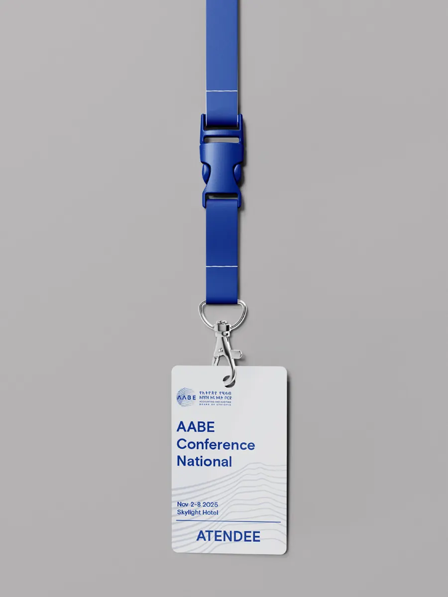 White AABE event badge marked Attendee, on a blue lanyard.