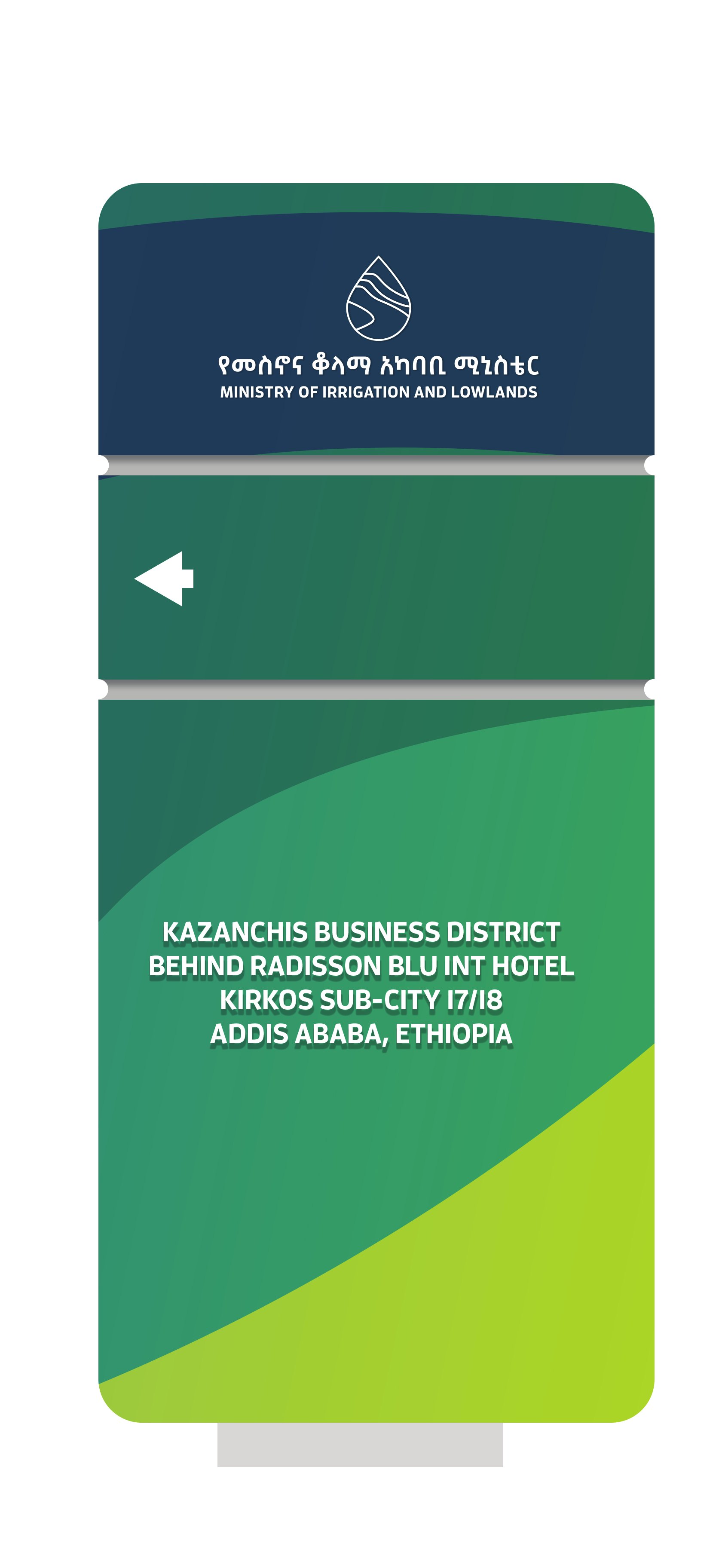 A MiLLS directional totem: the logo on navy, an arrow, and the address on a green-to-lemon panel.